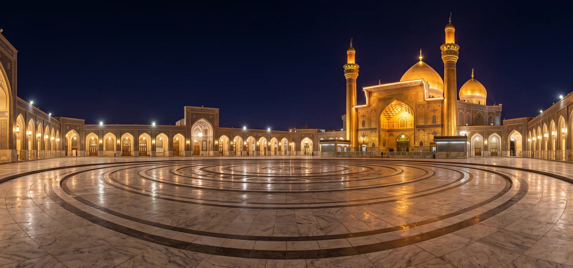 Illuminated sanctuary courtyard with concentric marble rings at night