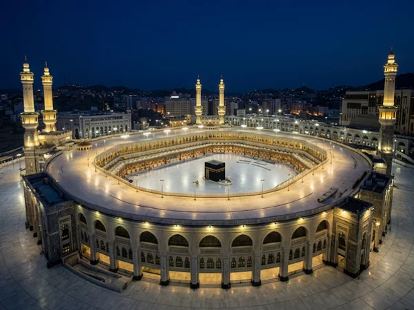 View from a high hotel window over the Haram courtyard at blue hour