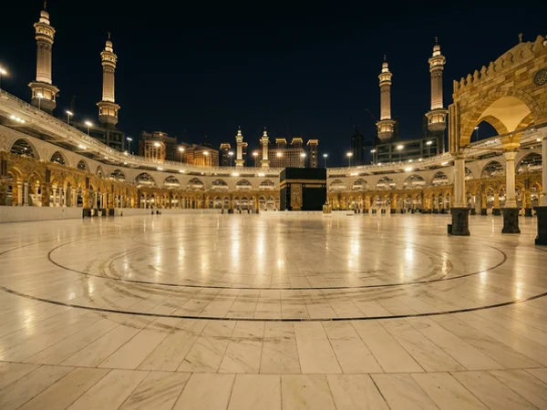 The Haram courtyard at night with warm floodlight on marble